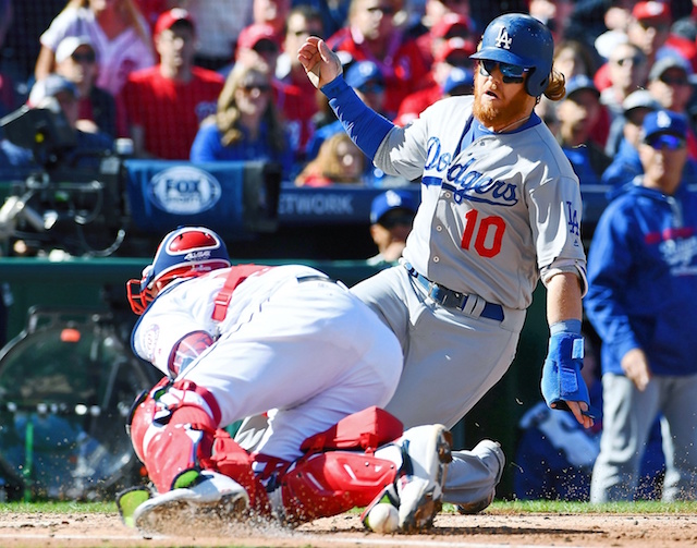 Los Angeles Dodgers third baseman Justin Turner slides into home plate