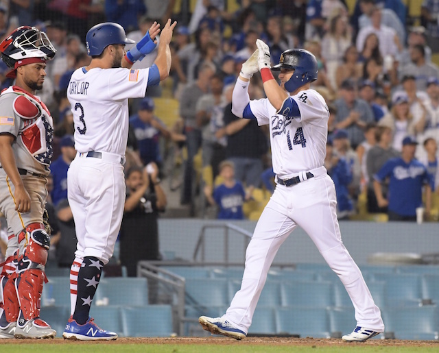 Los Angeles Dodgers teammates Chris Taylor and Kiké Hernandez celebrate a home run