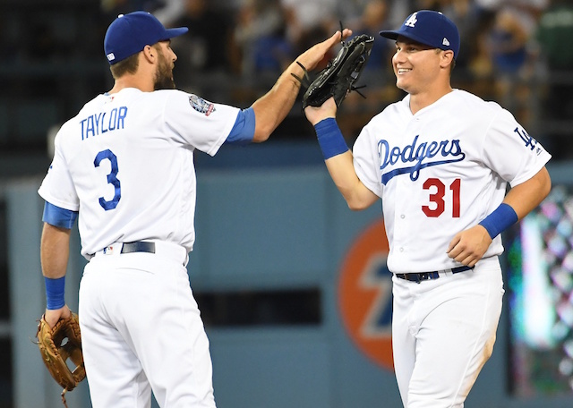 Los Angeles Dodgers teammates Joc Pederson and Chris Taylor celebrate after a win