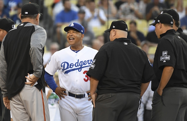 San Francisco Giants manager Bruce Bochy and Los Angeles Dodgers manager Dave Roberts with umpires before a game at Dodger Stadium