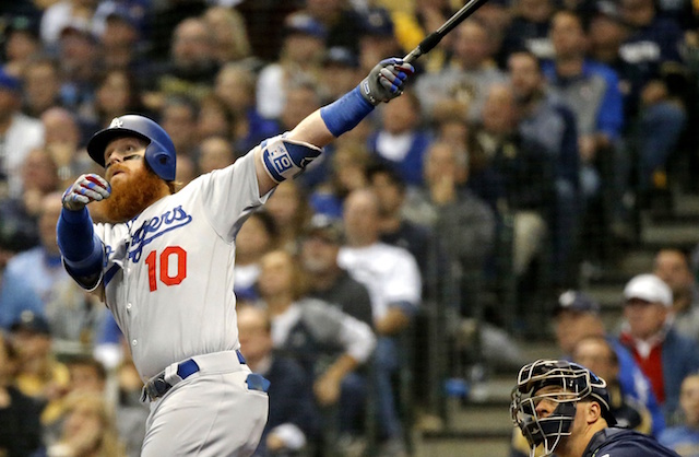 Los Angeles Dodgers third baseman Justin Turner hits a home run against the Milwaukee Brewers during the 2018 NLCS