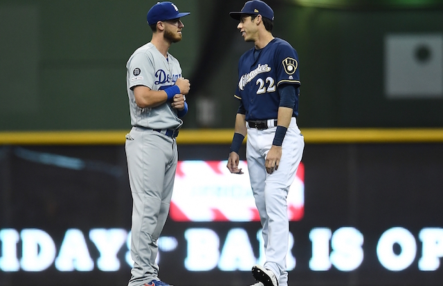 Los Angeles Dodgers All-Star Cody Bellinger and Milwaukee Brewers outfielder Christian Yelich talk before a game at Miller Park