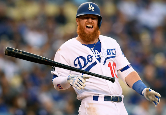 Los Angeles Dodgers third baseman Justin Turner reacts after being hit by a pitch