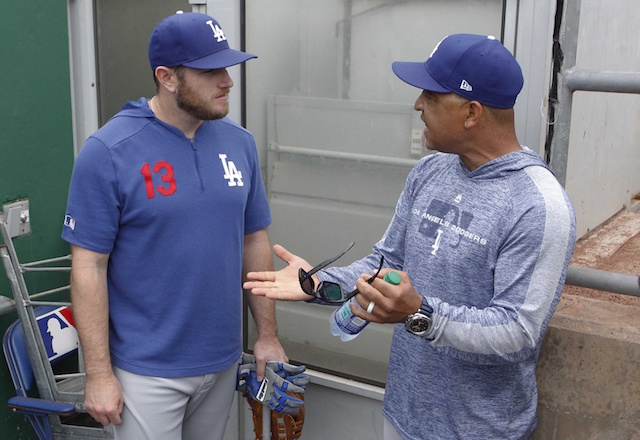 Los Angeles Dodgers manager Dave Roberts talks with Max Muncy during batting practice at PNC Park