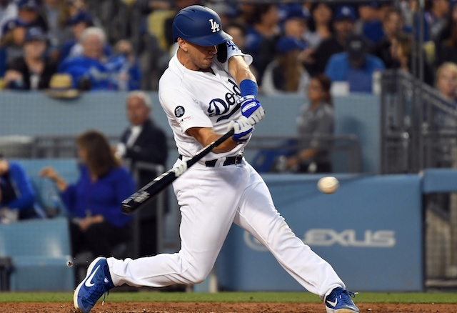 Los Angeles Dodgers catcher Austin Barnes hits a single against the Chicago Cubs