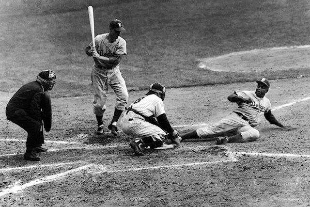 Jackie Robinson steals home plate during Game 1 of the 1955 World Series