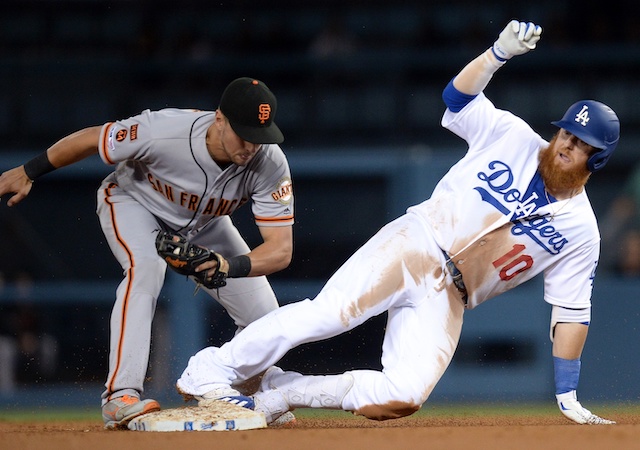 Los Angeles Dodgers third baseman Justin Turner slides into second base