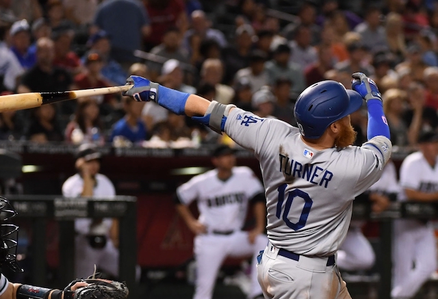 Los Angeles Dodgers third baseman Justin Turner hits a home run against Arizona Diamondbacks starting pitcher Robbie Ray