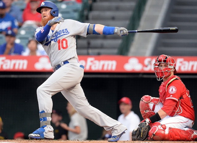 Los Angeles Dodgers third baseman Justin Turner hits a single against the Los Angeles Angels of Anaheim