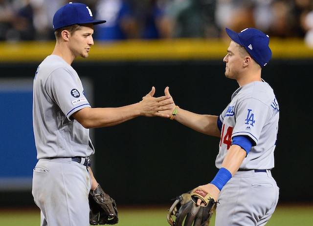 Los Angeles Dodgers teammates Kiké Hernandez and Corey Seager celebrate a win against the Arizona Diamondbacks