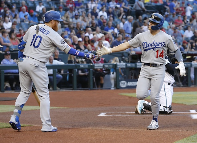 Los Angeles Dodgers second baseman Kiké Hernandez celebrates with Justin Turner after hitting a home run off Robbie Ray