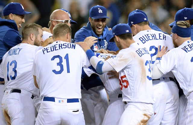 Matt Beaty, Cody Bellinger, Walker Buehler, Max Muncy, Joc Pederson, Alex Verdugo and the Los Angeles Dodgers celebrate Will Smith's walk-off home run