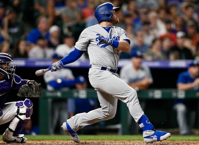 Los Angeles Dodgers infielder Max Muncy hits a home run against the Colorado Rockies