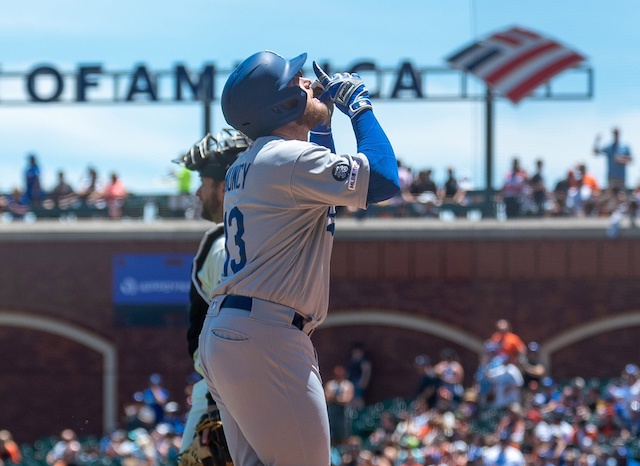 Los Angeles Dodgers infielder Max Muncy reacts after hitting a home run against the San Francisco Giants