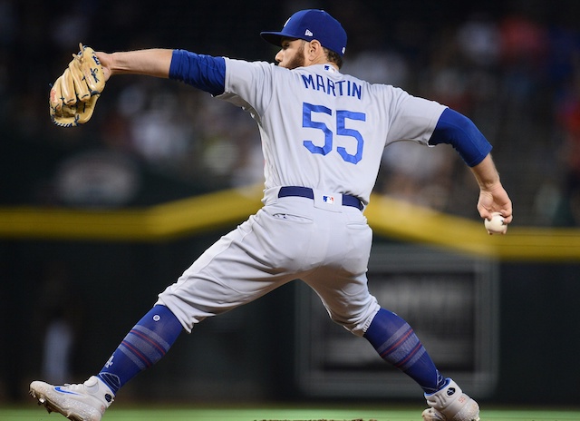 Los Angeles Dodgers catcher Russell Martin pitches against the Arizona Diamondbacks