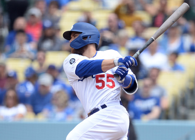 Los Angeles Dodgers catcher Russell Martin hits a single