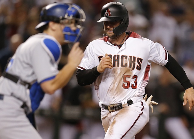 Los Angeles Dodgers catcher Will Smith waits for a throw against the Arizona Diamondbacks