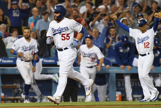 Dino Ebel, Russell Martin, Joc Pederson and Edwin Rios after a Los Angeles Dodgers walk-off win against the Arizona Diamondbacks