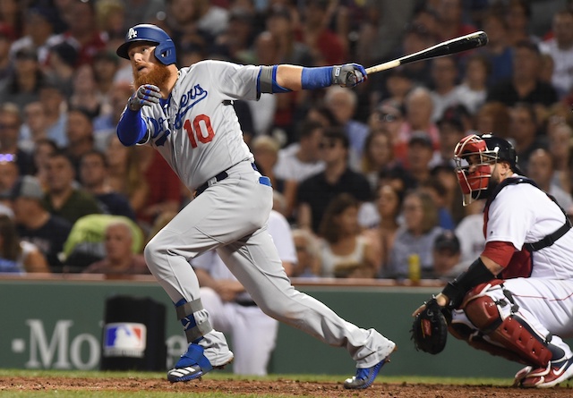 Los Angeles Dodgers third baseman Justin Turner hits a double against the Boston Red Sox