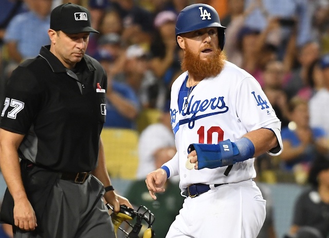 Los Angeles Dodgers third baseman Justin Turner scores a run against the Miami Marlins