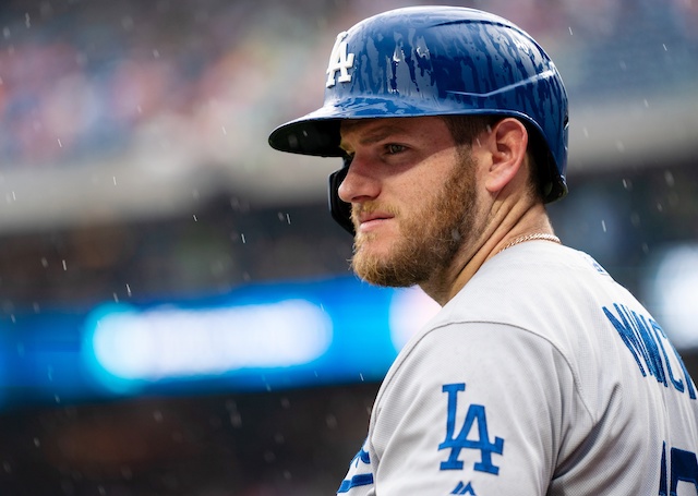 Los Angeles Dodgers infielder Max Muncy stands in the rain during a game at Citizens Bank Park