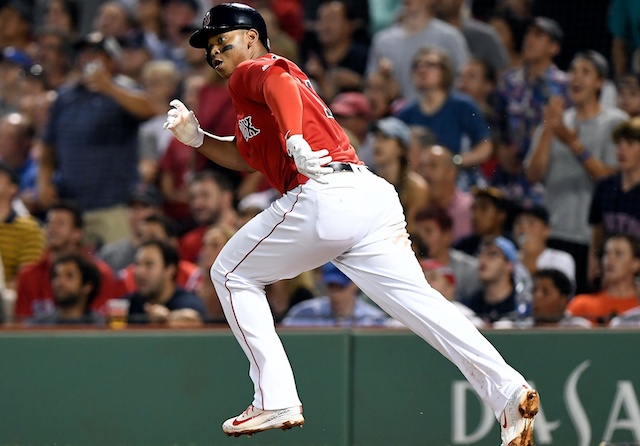 Boston Red Sox third baseman Rafael Devers hits a double against the Los Angeles Dodgers