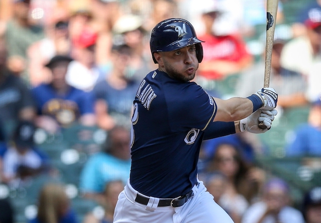 Milwaukee Brewers outfielder Ryan Braun hits a triple against the Atlanta braves