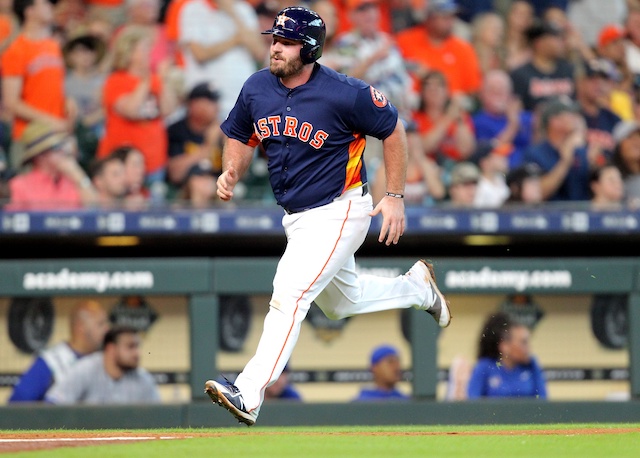 Houston Astros infielder Tyler White scores a run