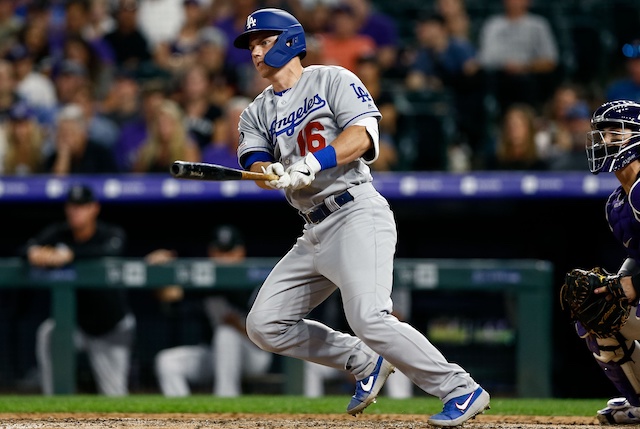 Los Angeles Dodgers catcher Will Smith hits a double against the Colorado Rockies