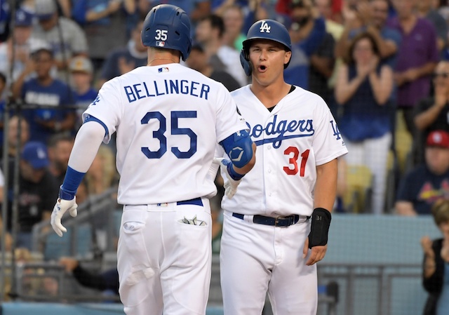 Los Angeles Dodgers teammates Cody Bellinger and Joc Pederson celebrate after a home run