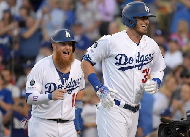 Los Angeles Dodgers teammates Cody Bellinger and Justin Turner celebrate after a home run