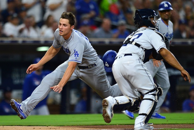 Los Angeles Dodgers third base coach Dino Ebel watches Corey Seager score a run against the San Diego Padres