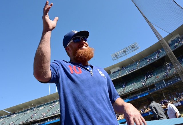 Los Angeles Dodgers third baseman Justin Turner waves to fans at Dodger Stadium