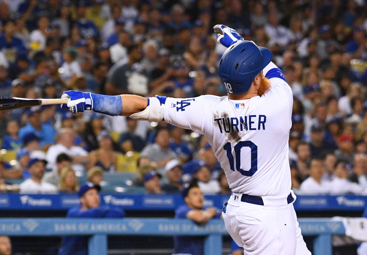 Los Angeles Dodgers third baseman Justin Turner hits a home run against the San Diego Padres