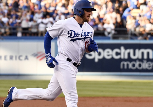 Los Angeles Dodgers infielder Max Muncy rounds the bases after hitting a home run against the Arizona Diamondbacks