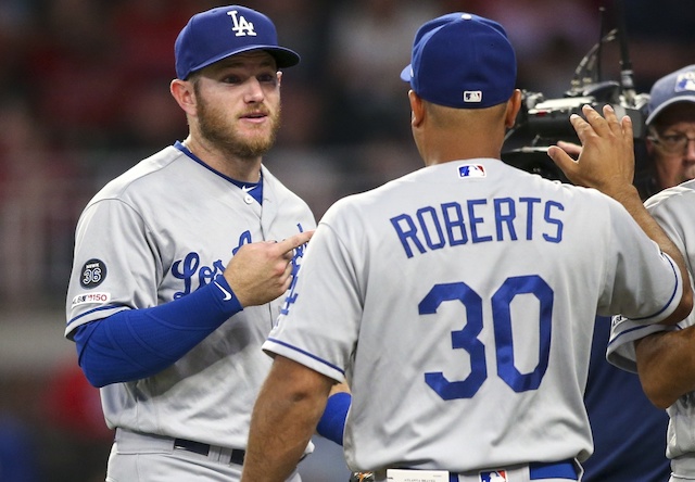 Los Angeles Dodgers manager Dave Roberts and Max Muncy celebrate after a win