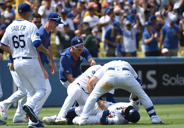 Walker Buehler, Kiké Hernandez, Russell Martin, Joc Pederson and Casey Sadler celebrate after a Los Angeles Dodgers walk-off win