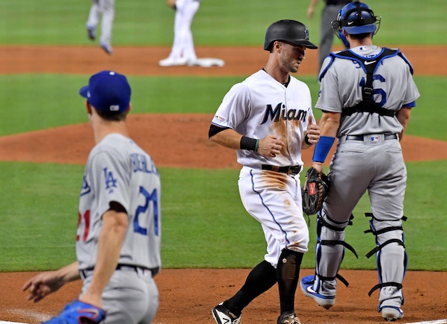 Los Angeles Dodgers pitcher Walker Buehler backs up a play at home plate