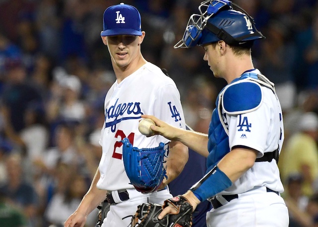 Walker Buehler and Will Smith celebrate after a Los Angeles Dodgers win