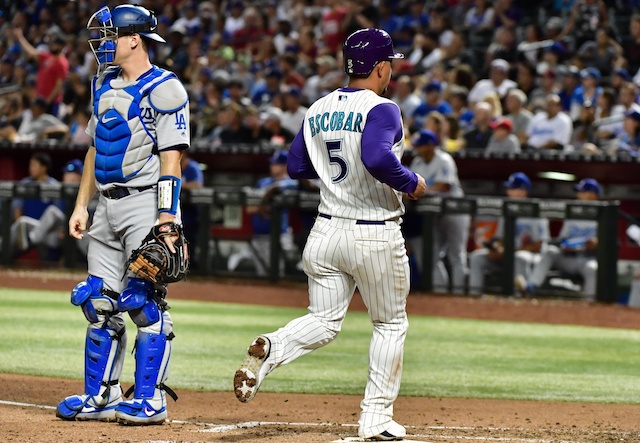 Los Angeles Dodgers catcher Will Smith looks on as the Arizona Diamondbacks score a run