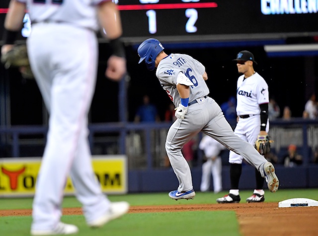 Los Angeles Dodgers catcher Will Smith rounds the bases after hitting a home run against the Miami Marlins