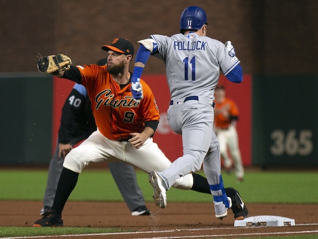 Los Angeles Dodgers outfielder A.J. Pollock runs to first base