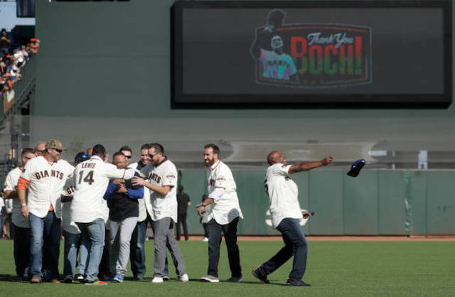 Former San Francisco Giants players greet Los Angeles Dodgers manager Dave Roberts during the Bruce Bochy ceremony