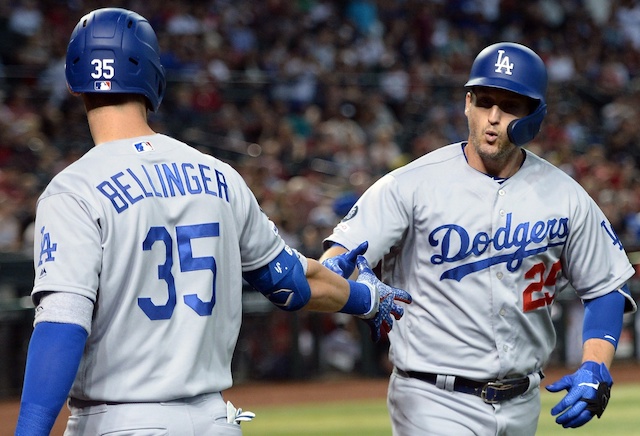 Los Angeles Dodgers teammates Cody Bellinger and David Freese celebrate after a home run