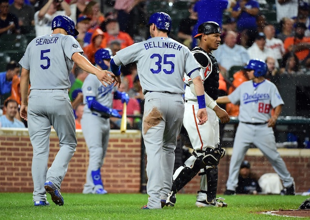 Los Angeles Dodgers teammates Cody Bellinger and Corey Seager celebrate after scoring