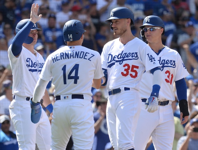 Los Angeles Dodgers teammates Cody Bellinger, Kiké Hernandez, Gavin Lux and Joc Pederson celebrate after a grand slam