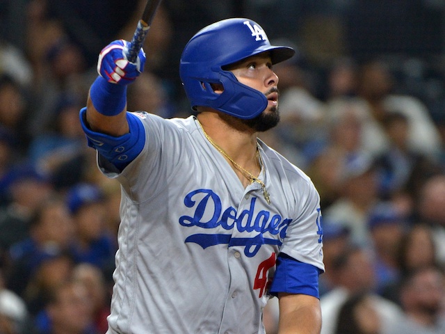 Los Angeles Dodgers infielder Edwin Rios hits a home run against the San Diego Padres