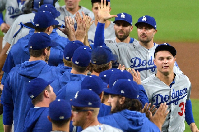 Los Angeles Dodgers teammates Matt Beaty, Joc Pederson, A.J. Pollock and Chris Taylor celebrate after a win