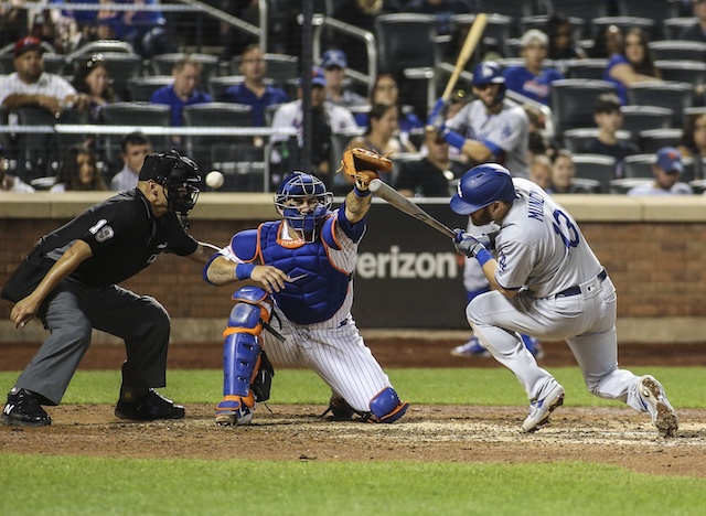 Los Angeles Dodgers infielder Max Muncy avoids being hit by a pitch