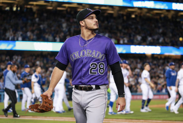 Colorado Rockies third baseman Nolan Arenado walks off the field after a Los Angeles Dodgers win